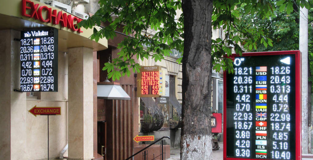 city street with currency exchange signs