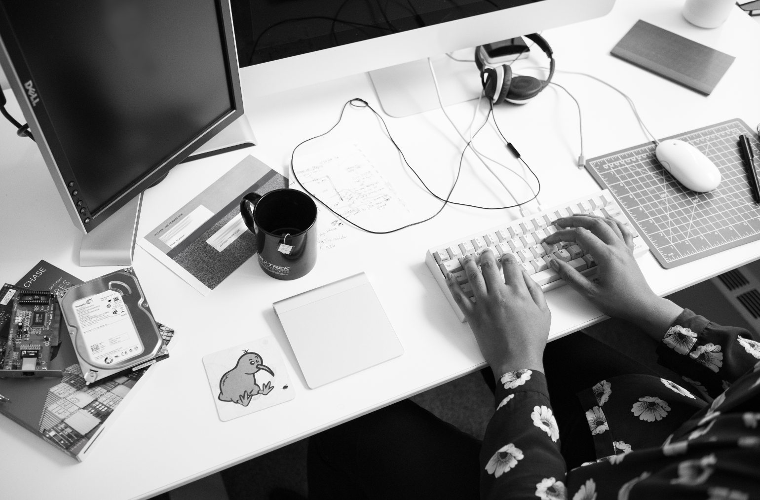 programmer at keyboard on desk