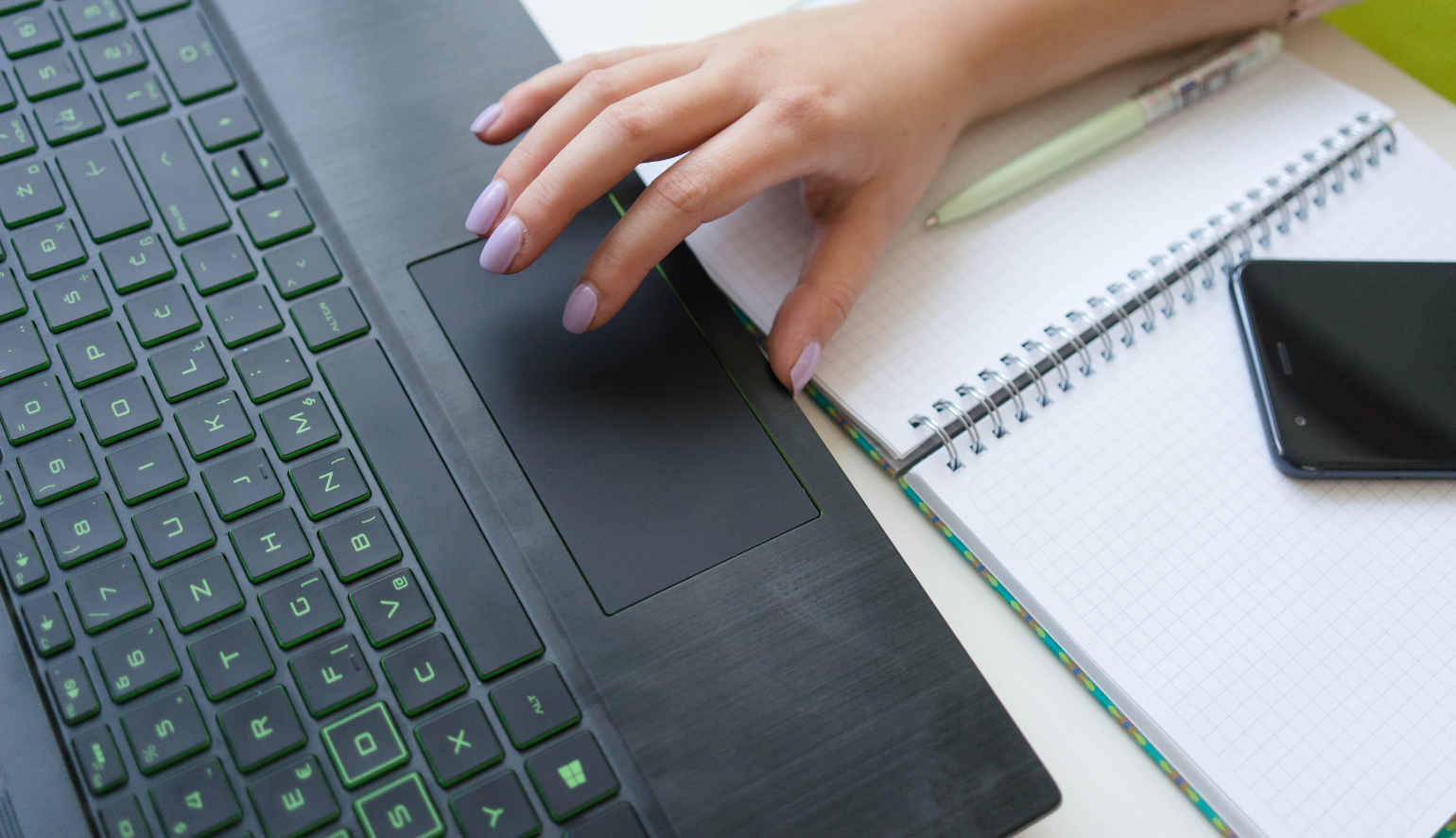 woman typing at desk