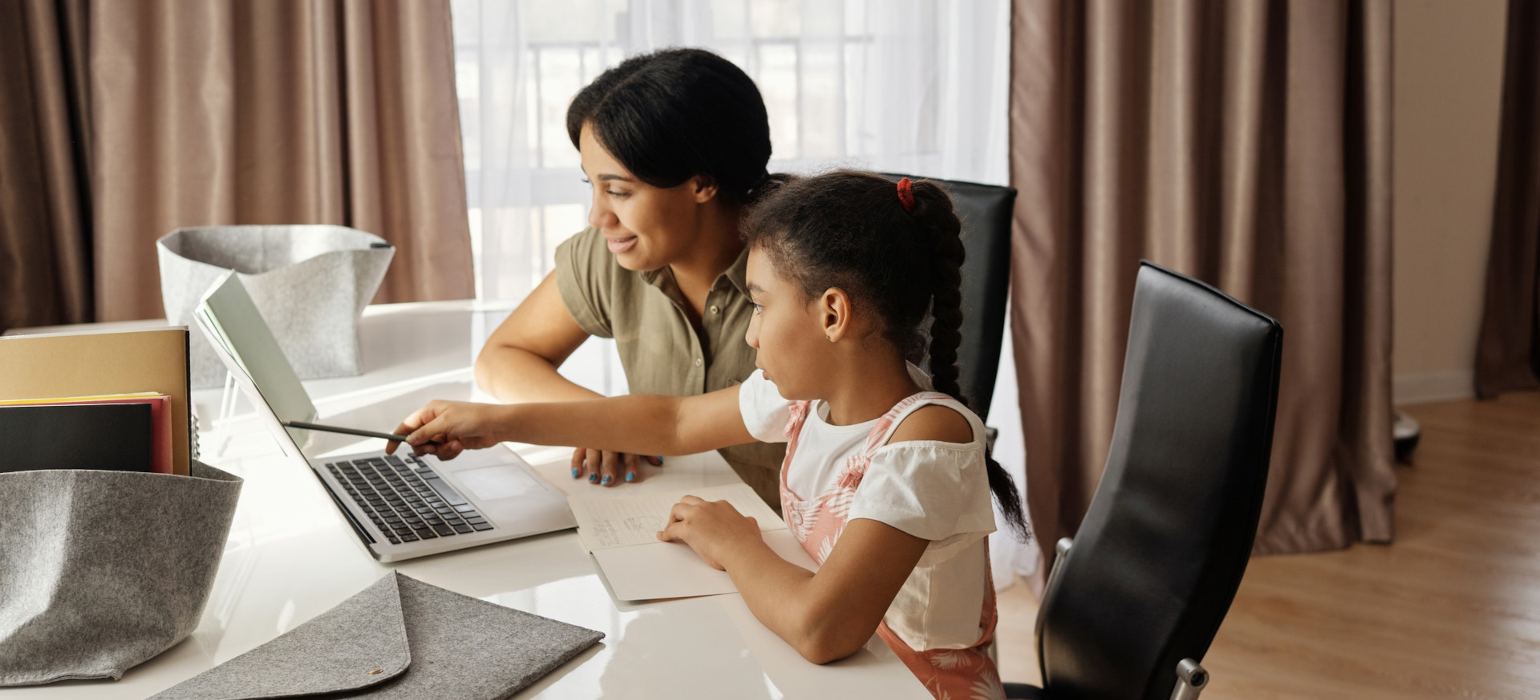 Mom & daughter working at a computer