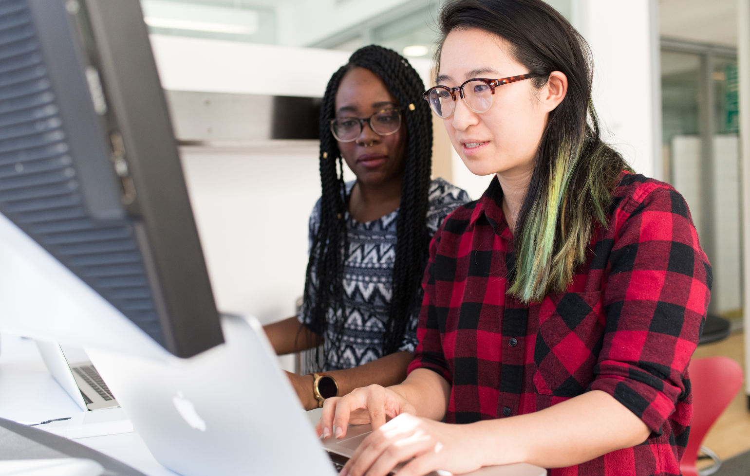 Two software developers at their computers