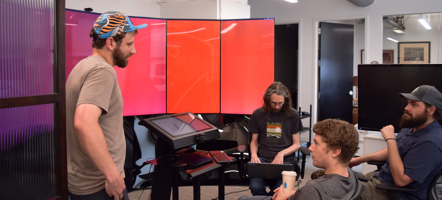 Neil, Jacob, Matt, and Will working on the Liquid Galaxy