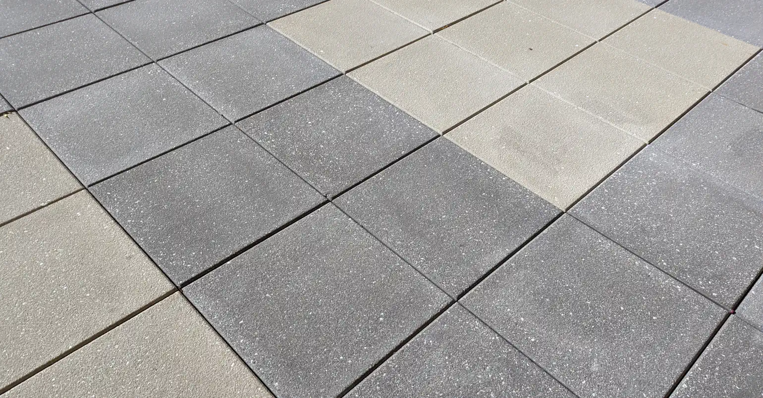 Angle view of square paving stones in two colors, in a pattern