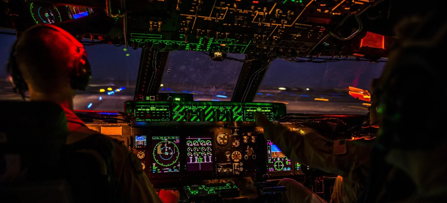 Photo of 2 pilots in an airplane cockpit