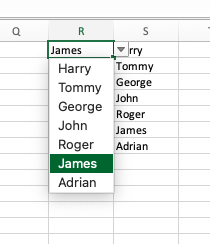 An Excel column reading “R” has a cell reading “James”. A dropdown is open, showing options Harry, Tommy, George, John, Roger, James (highlighted), and Adrian. Cells in column S hold this list of names.