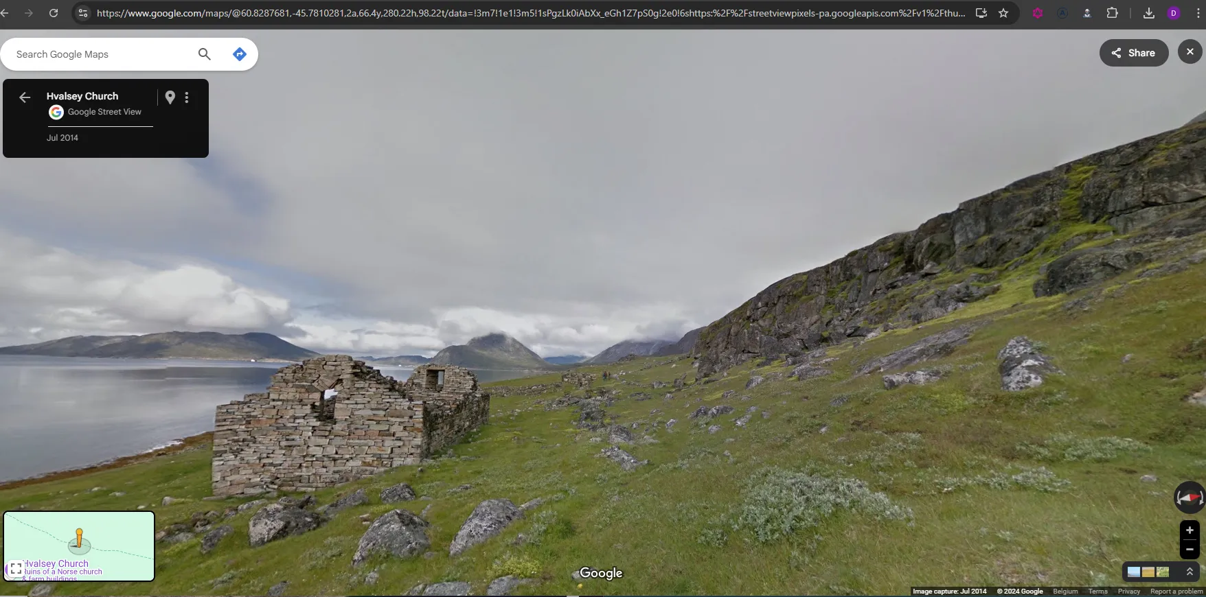 A Google Street View spherical image of hills in Greenland, with a Google Maps label reading “Hvalsey Church”, with a brick building and the ocean visible